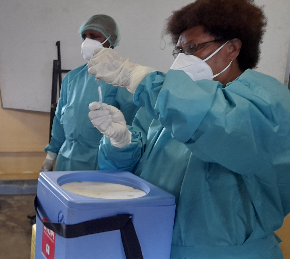 Nurse preparing vaccines for administration