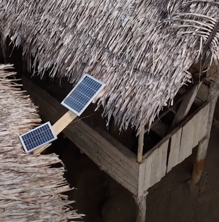 Solar panels between two huts