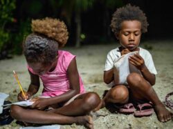 Children make the most of solar lighting in Finschhafen